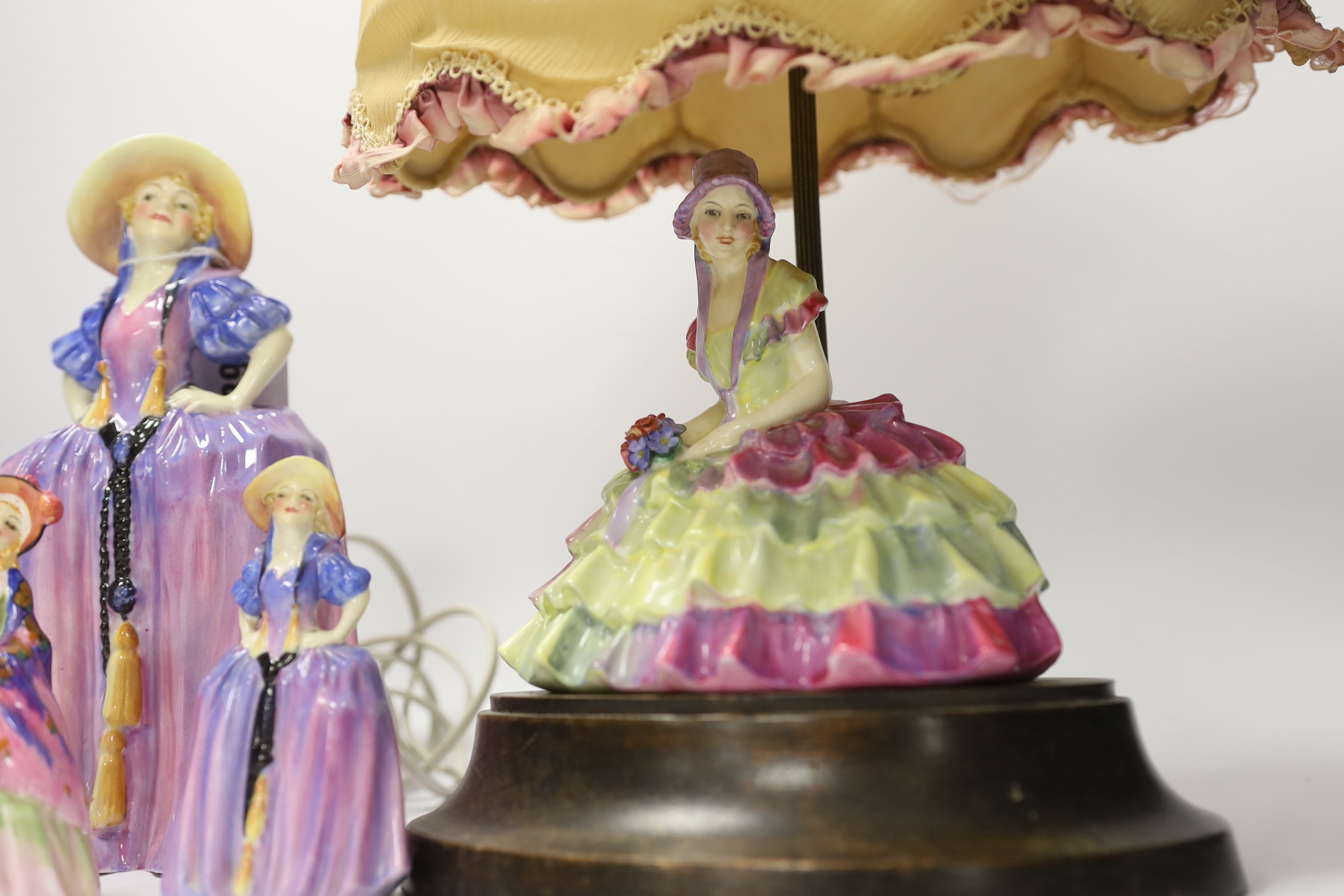 Six Royal Doulton figurines comprising two Patricia HN1431 (one miniature), miniature Pantalettes, The Paisley Shawl and Sweet Anne together with Chloe HN1470, mounted as a lamp